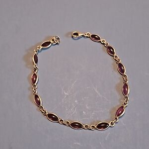 Sterling silver bracelet with small purple stones